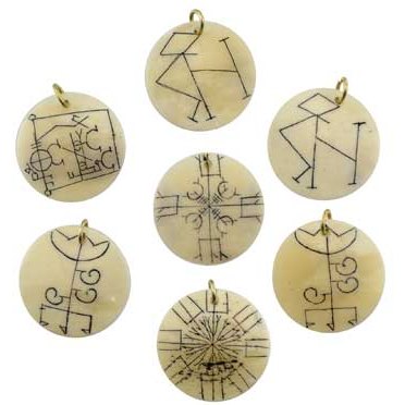 Tibetan Bone Charm set of 23 with carved symbols for protection and empowerment.