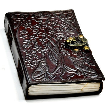 Wolf and Tree of Life leather blank book with latch, featuring embossed design, Celtic knots, and metal clasp.