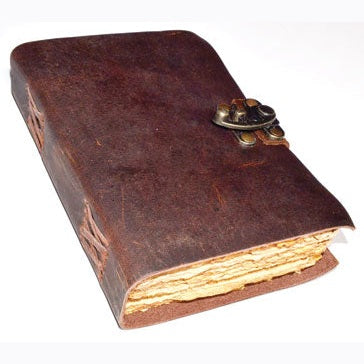 Aged paper leather journal with latch closure and rough-edged pages.