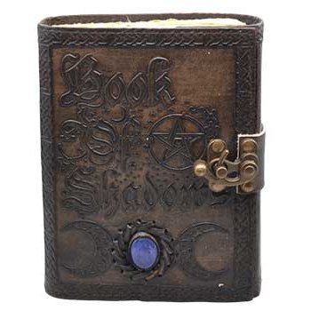 Book of Shadows with aged paper, leather cover, triple moon design, blue stone, and latch closure.