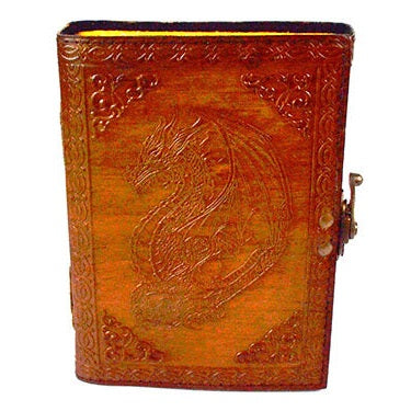 Embossed leather dragon journal with aged paper and latch.