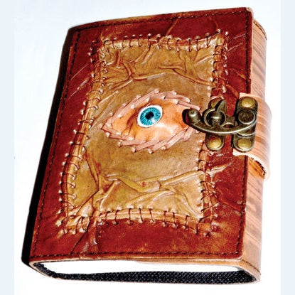 Knowing Eye leather blank book with embossed eye design and metal latch.