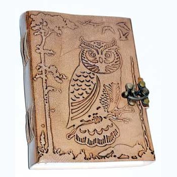 Hand tooled 5" x 7" leather journal with embossed owl design and latch closure.