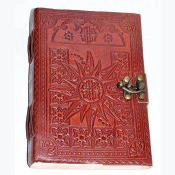 Handmade 5" x 7" leather journal with embossed sun design and latch closure.