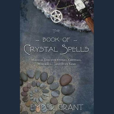 Book cover of "Book of Crystal Spells" by Ember Grant featuring crystals and magical elements.