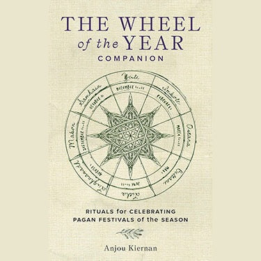 Hardcover book The Wheel of the Year Companion by Anjou Kiernan with pagan holiday rituals and seasonal spells guide