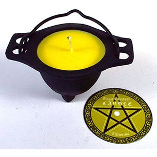 Citronella candle in reusable cast iron cauldron for insect repellent.