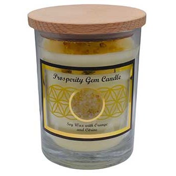 Prosperity gemstone soy candle with citrine chips in glass jar and wooden cover.