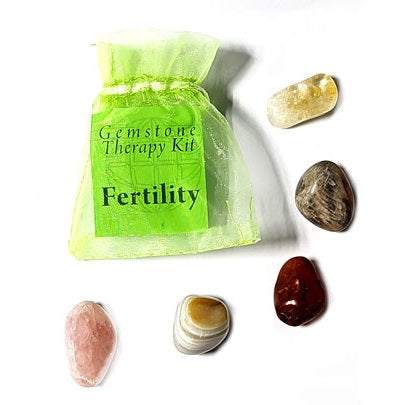 Fertility gemstone therapy kit with agate, carnelian, citrine, moonstone, and rose quartz in green organza bag