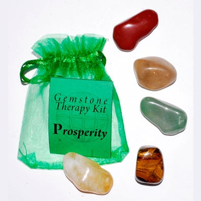 Prosperity gemstone therapy kit with citrine, green aventurine, red jasper, tiger eye, and topaz in a green organza bag