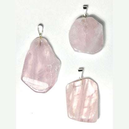Unique rose quartz slice pendant with natural pink hues from Brazil for emotional healing and love energy