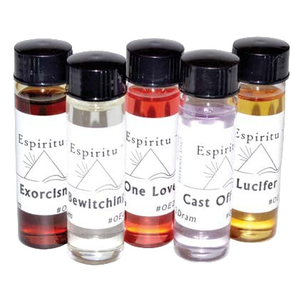 Set of five small bottles with labels on a white background