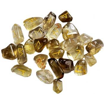 Citrine rune set with hand carved runic letters on polished yellow and brown stones for divination and manifestation.
