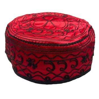 Elegua santeria hat with red and black design, representing the orisha of roads and paths.