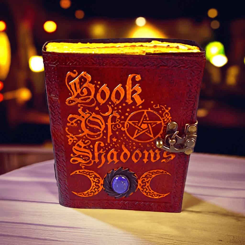 Embossed Book of Shadows Leather Journal with Latch, shown in use