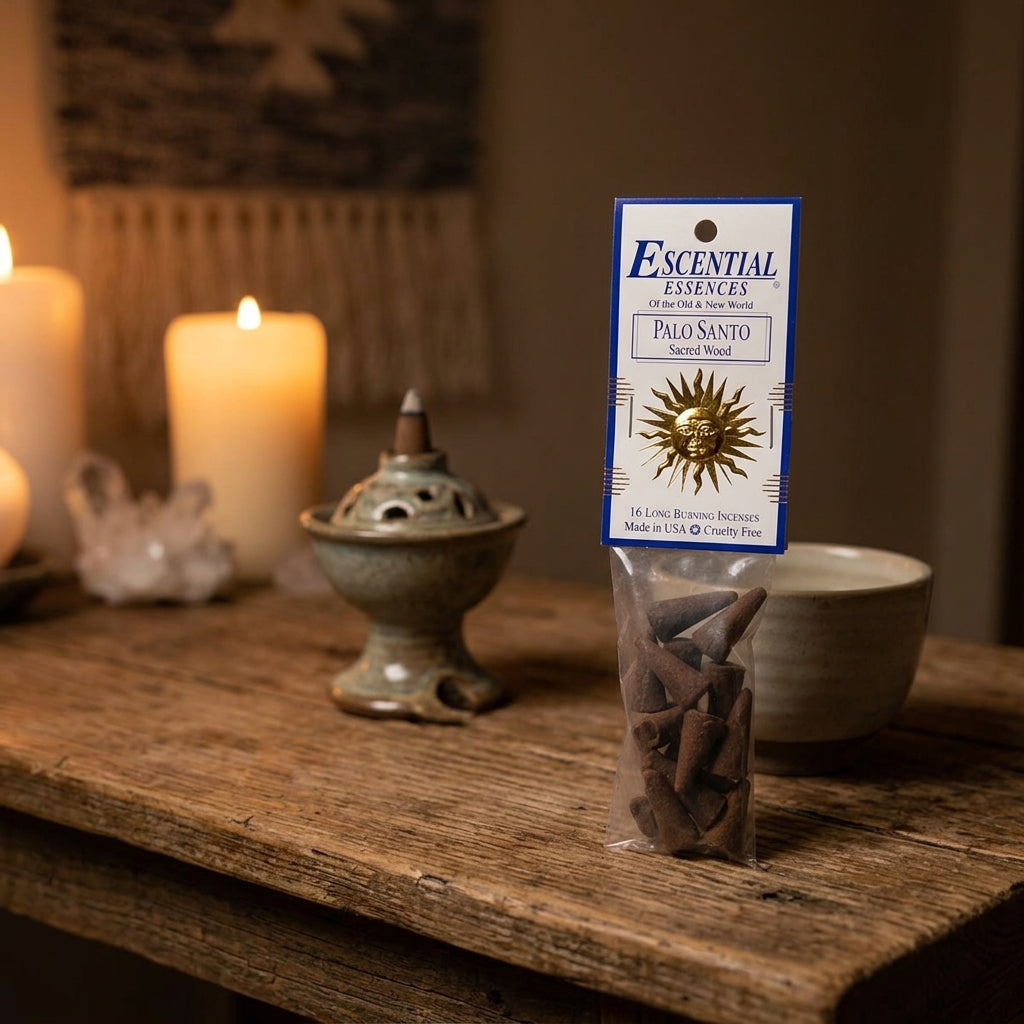 Small Palo Santo incense cone in a ceramic diffuser within a cozy meditation nook, glowing softly for cleansing and spiritual practice.