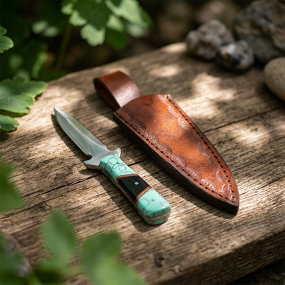 Close-up of a 7-inch turquoise and black handled athame on a natural wooden altar, highlighting the textured stainless steel blade and polished handle.
