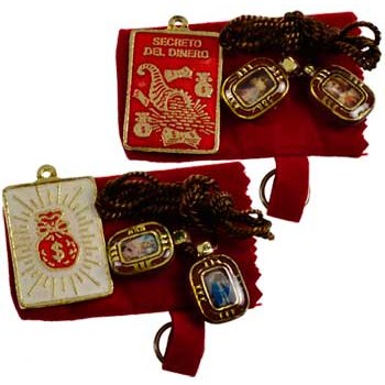 Money talisman with pewter design and cords for wealth spells.