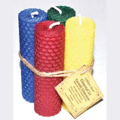 Set of four 4 1/4" beeswax elemental candles in blue, green, red, and yellow, handcrafted with essential oils for ritual and spiritual use.