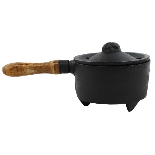 Vintage cast iron incense burner with wooden handle for burning powders, resins, and granules on charcoal with minimal cleanup.