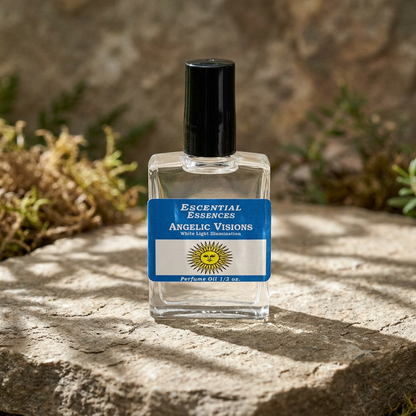 Close-up of Angelic Visions Perfume Oil bottle on natural stone with soft sunlight and earthy background, highlighting minimalist glass design and subtle glow.