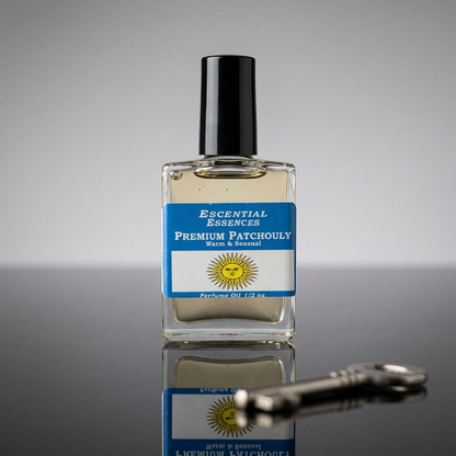 Close-up of Patchouli perfume oil bottle on sleek black surface with neutral studio background, focusing on crystal clarity and amber hue.