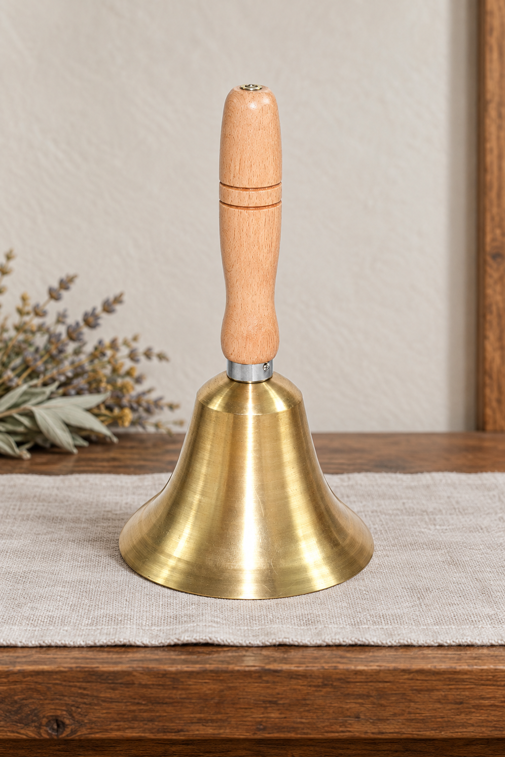 Brass hand bell on a wooden altar