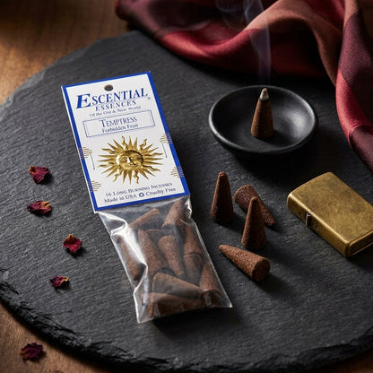Detailed close-up of Temptress Forbidden Fruit Incense Cones showing textures and packaging details on a natural surface.