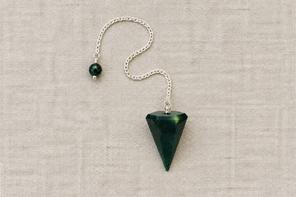 Dark green pendulum flat lay