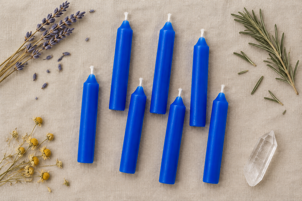 Flat lay of blue candles on linen