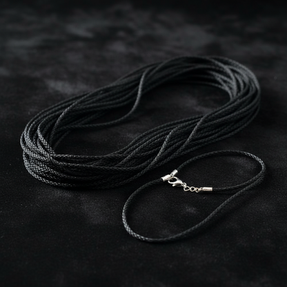 You will be generating high-quality product photos for an online stores product page. The product images should closely match the original products.
      Here is the prompt (IMPORTANT!): """A close-up, ultra-detailed shot of a single 24' braided black cor