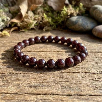 You will be generating high-quality product photos for an online stores product page. The product images should closely match the original products.
      Here is the prompt (IMPORTANT!): """Generate a photorealistic style image of the 8mm Garnet Bracelet 