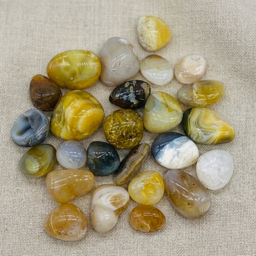 You will be generating high-quality product photos for an online stores product page. The product images should closely match the original products.
      Here is the prompt (IMPORTANT!): """Capture a close-up, macro shot of the 'Agate Natural Tumbled Ston