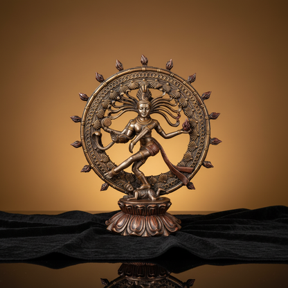An evocative, studio-shot image of the Shiva Nataraja Statue, 9 Inches, placed on a dark velvet cloth under a professional HDR studio light setup. The lighting accentuates the detailed carvings and the flowing attributes of Shiva’s dance, creating delicate
