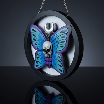 Capture a highly detailed, hyperrealistic studio shot of the 'Hanging Skull on Butterfly Plaque' set against a sleek, matte charcoal backdrop. Use HDR studio lighting with softboxes to evenly illuminate the intricate textures of the skull and delicately hi