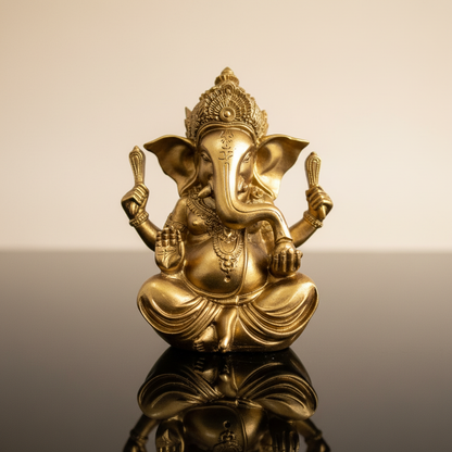A highly detailed, photorealistic image of a Gold Ganesha Statue, 5 3/4 inches tall, set against a soft, neutral gradient background that highlights the statue’s intricate craftsmanship. The scene is illuminated with HDR studio lighting, featuring diffused