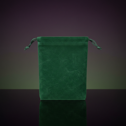Capture a highly detailed studio shot of the Green Velveteen Bag, 4' x 5 1/2', positioned prominently on a reflective black surface to highlight its plush velveteen texture and rich, lush appearance. Use softbox lighting from above and to the side, creatin