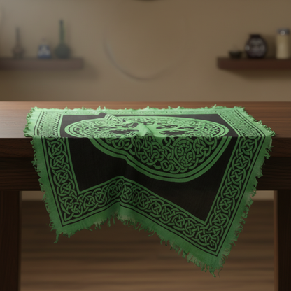 Create a high-resolution, cinematic studio shot of an 18'x18' Tree of Life altar cloth, spread out gracefully on a luxurious altar table. The scene is illuminated by softbox lighting that highlights the intricate Celtic knot design of the large central Tre