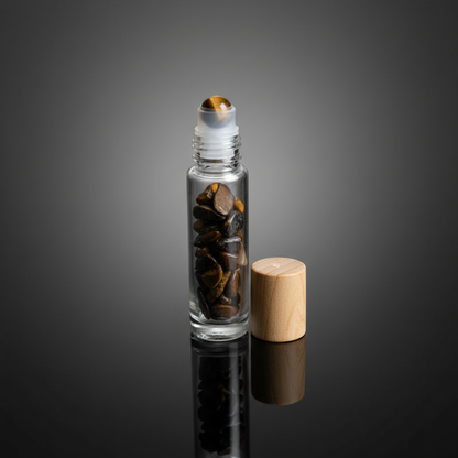 Capture a close-up, studio shot of a 10ml Tiger's Eye roller bottle, emphasizing the smooth, polished gemstone rolling ball on top, set against a sleek, reflective black surface. Use HDR studio lighting with a softbox to highlight the warm, rich hues of th