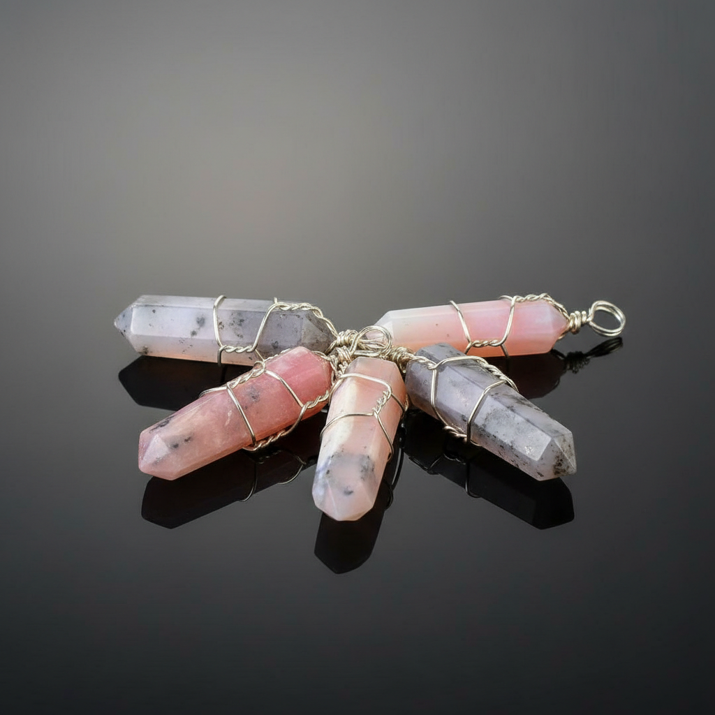 Create a highly detailed, studio-quality image featuring a set of five pink opal wire-wrapped points, each approximately 1.5 inches in length. The scene is illuminated with softbox lighting to highlight the gentle, soothing hues of the pink opal stones. Po