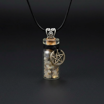 Create a highly detailed studio shot of the 'Black Moonstone Chips in Bottle with Pentagram necklace', captured from a slightly elevated angle to emphasize the length of the necklace and the intricate details of the vial. Use softbox lighting with a subtle