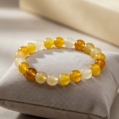 A highly detailed, studio-shot image of a Yellow Jade bracelet with 8mm beads, captured using softbox lighting for a warm, inviting glow. The camera is set at a close-up shot with a macro lens at 50mm focal length, emphasizing the smooth, polished surface 