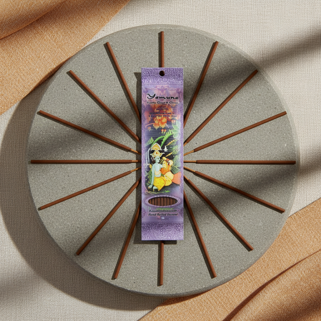 Imagine a professional images of the 'Yamuna incense stick 10 pack' arranged artistically on a minimalist, zen-inspired environment. Use HDR studio lighting with diffused daylight effects to highlight the fine craftsmanship of the handmade incense sticks a