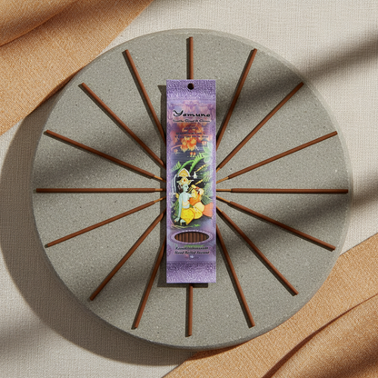 Imagine a professional images of the 'Yamuna incense stick 10 pack' arranged artistically on a minimalist, zen-inspired environment. Use HDR studio lighting with diffused daylight effects to highlight the fine craftsmanship of the handmade incense sticks a