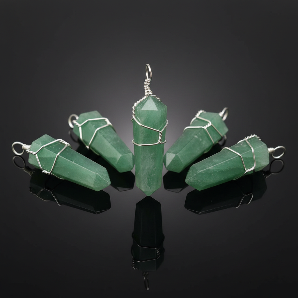 Create a luxurious, high-resolution studio shot of a set of five Green Aventurine point pendants, each about 1 3/8 inches long, arranged in an elegant semi-circle on a reflective black glass surface. The lighting involves softbox diffuse daylight to highli