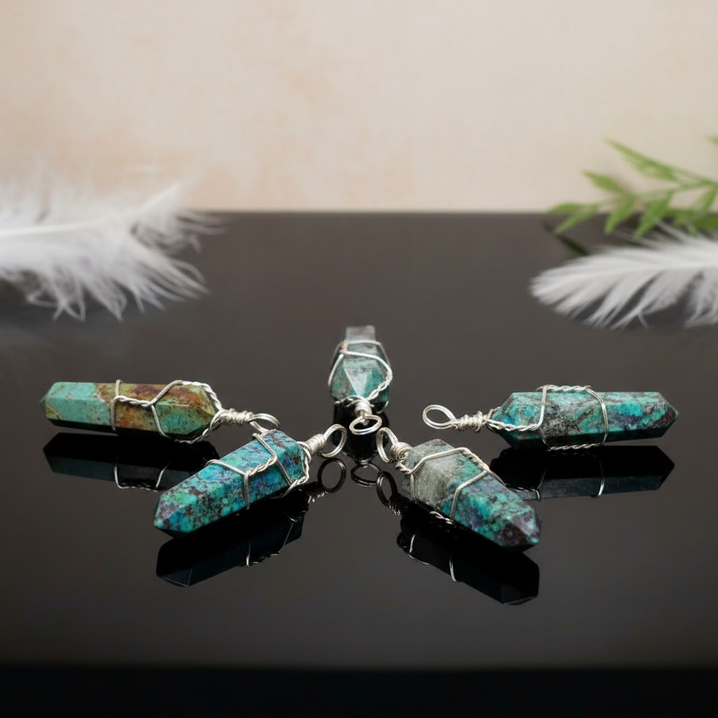 Visualize a luxurious product display scene with a set of five wire-wrapped Chrysocolla crystal point pendants elegantly arranged on a reflective black surface. Illuminate the scene with HDR studio lighting to accentuate the vibrant blue and green hues, cr