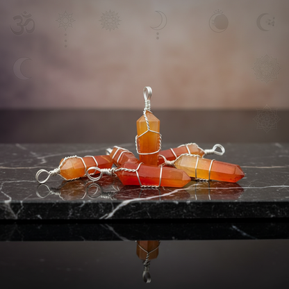 Create a highly detailed studio scene featuring a set of five wire-wrapped Carnelian crystal points, each approximately 1 3/8 inches tall, displayed on a sleek, reflective black marble slab. Use HDR studio lighting with softboxes to achieve gentle, even il