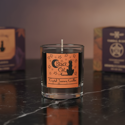A serene, hyper-realistic studio scene featuring the Black Cat soy votive candle placed on a polished black marble surface, illuminated by softbox lighting that highlights its sleek, matte black ceramic holder shaped like a resting cat. The scene is shot f