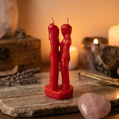 Full-body shot of 7-inch Red Lovers Candle on polished stone in cozy ritual room with warm lighting.