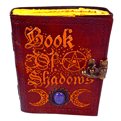 Leather Book of Shadows with embossed design, aged paper, and stone accent.